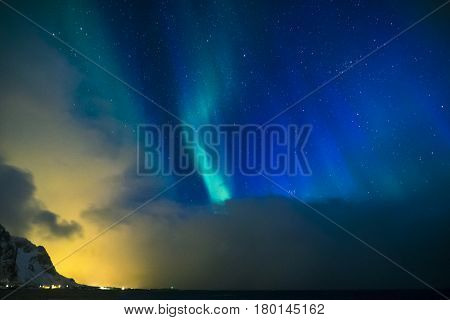 Aurora Borealis Known as Nother Lights Playing with Vivid Colors Over Lofoten Islands in Norway. Horizontal Image Orientation