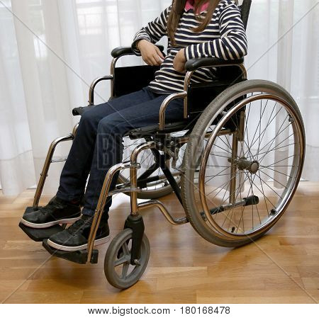 Paraplegic Young Girl In A Wheelchair