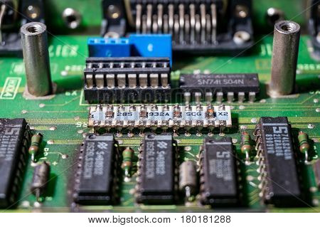 different microchips and transistors on an old circuit board