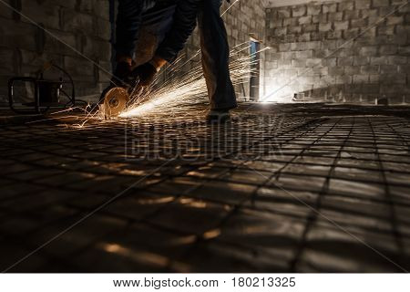 Work of electric saw for metal view in studio being repaired sparks all around worker