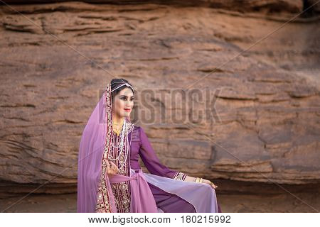 Persia or Iran Women's in persia traditional dress rock background