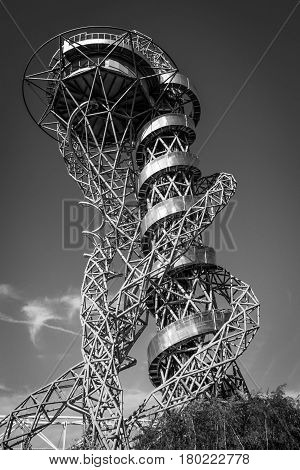 London, England - October 17, 2016 - ArcelorMittal Orbit black and white tubular steel abstract structure spiraling skyward with silver outer walkway and stainless steel steel slide curling down at 114.5 metre London's tallest sculpture a popular tourist 
