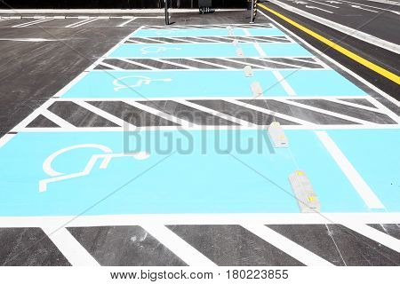 markings for a handicapped parking stall in a parking lot