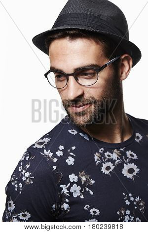 Trilby hat man in floral t-shirt studio shot