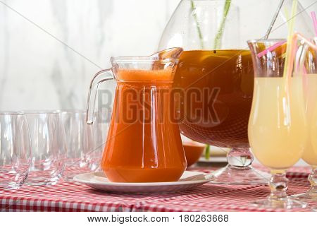 Fresh juice on a table in a restaurant. Healthy drinks. carrot fresh in a jar.