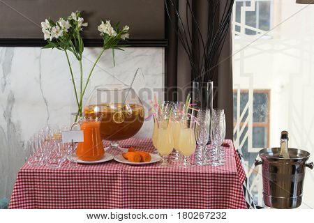 Fresh juice on a table in a restaurant. Healthy drinks. carrot fresh in a jar.