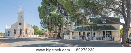 PHILIPPOLIS SOUTH AFRICA - MARCH 21 2017: A panoramic street scene with the Dutch Reformed Church and historic buildings in Philippolis the oldest town in the Free State Province