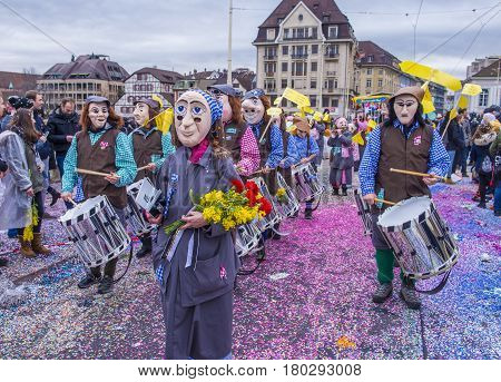 BASEL SWITZERLAND - MARCH 08 : Participants in the Basel Carnival in Basel Switzerland on March 08 2017. The Basel carnival has been listed as one of the top local festivities in Europe