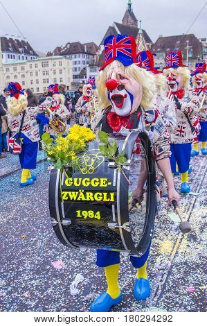 BASEL SWITZERLAND - MARCH 08 : Participants in the Basel Carnival in Basel Switzerland on March 08 2017. The Basel carnival has been listed as one of the top local festivities in Europe