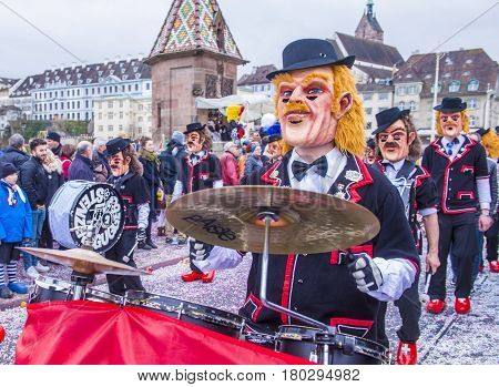BASEL SWITZERLAND - MARCH 08 : Participants in the Basel Carnival in Basel Switzerland on March 08 2017. The Basel carnival has been listed as one of the top local festivities in Europe