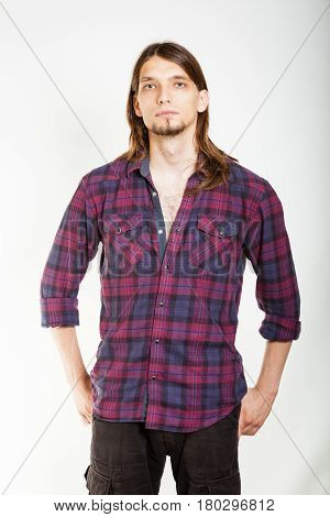 Masculinity concept. Man in plaid shirt. Young male posing on white background.