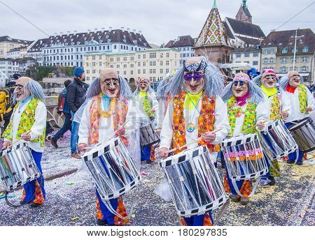 BASEL SWITZERLAND - MARCH 08 : Participants in the Basel Carnival in Basel Switzerland on March 08 2017. The Basel carnival has been listed as one of the top local festivities in Europe