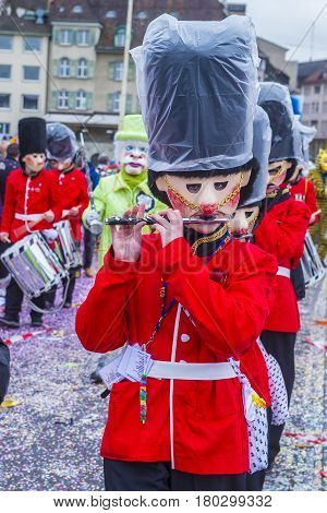 BASEL SWITZERLAND - MARCH 08 : Participants in the Basel Carnival in Basel Switzerland on March 08 2017. The Basel carnival has been listed as one of the top local festivities in Europe
