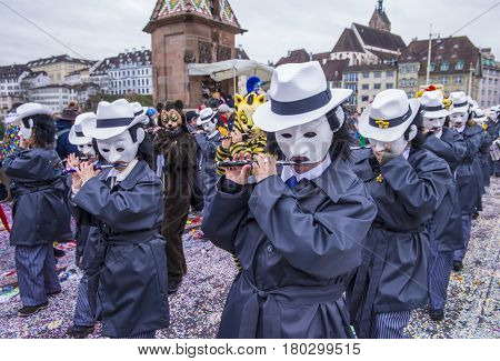 BASEL SWITZERLAND - MARCH 08 : Participants in the Basel Carnival in Basel Switzerland on March 08 2017. The Basel carnival has been listed as one of the top local festivities in Europe