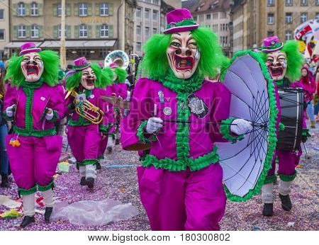 BASEL SWITZERLAND - MARCH 08 : Participants in the Basel Carnival in Basel Switzerland on March 08 2017. The Basel carnival has been listed as one of the top local festivities in Europe