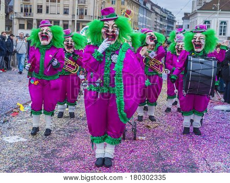 BASEL SWITZERLAND - MARCH 08 : Participants in the Basel Carnival in Basel Switzerland on March 08 2017. The Basel carnival has been listed as one of the top local festivities in Europe