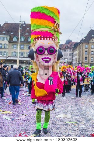 BASEL SWITZERLAND - MARCH 08 : Participants in the Basel Carnival in Basel Switzerland on March 08 2017. The Basel carnival has been listed as one of the top local festivities in Europe