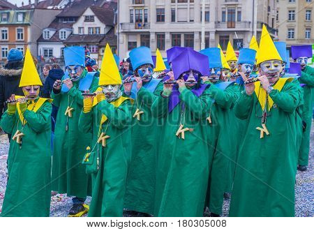 BASEL SWITZERLAND - MARCH 08 : Participants in the Basel Carnival in Basel Switzerland on March 08 2017. The Basel carnival has been listed as one of the top local festivities in Europe