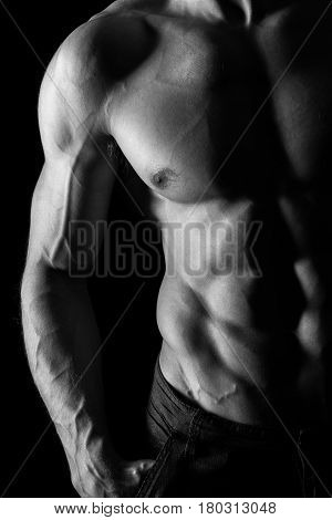Muscular Torso of Sexy Shirtless Young Male Model Close Up on Black Background