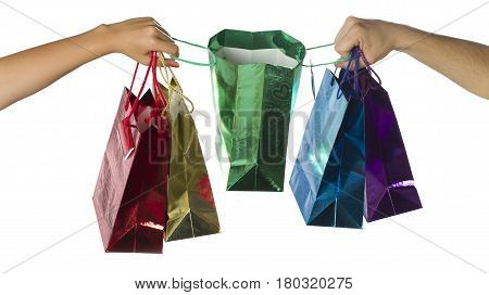 Female and male hands with giftbags on white background