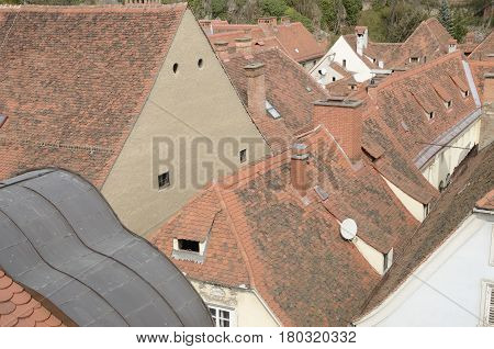 Tile roofs of the city from the terrace of the Kastner and Ohler warehouses in Graz the capital of federal state of Styria Austria.