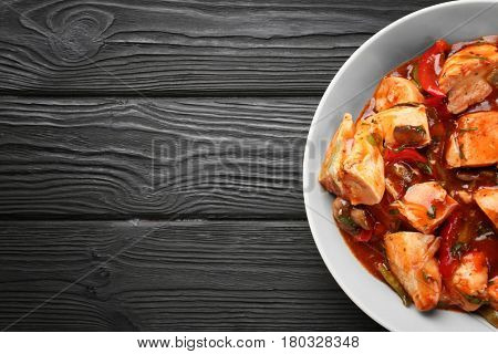 Plate with chicken cacciatore on kitchen table