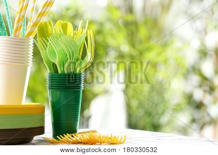 Plastic ware on table outdoors