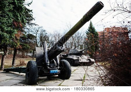 Old Vintage Military Howitzer At City Pedestal.