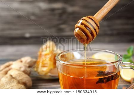 Hot drink with honey for cough remedy, closeup