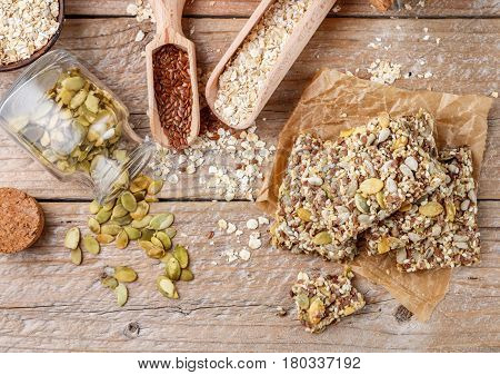 Healthy Snack - Crispy Cereal Cookies On Old Wooden Table And Ingredients: Oat Flakes, Flax Seed, Pu