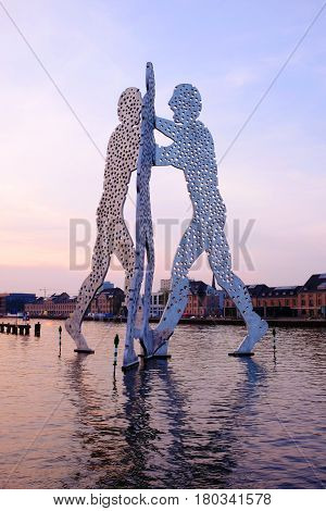 View on the Molecule Man sculpture on sunrise on the river Sprea. Berlin Germany - 01.04.2017.