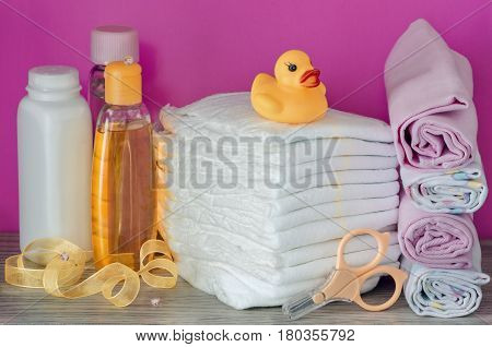 accessories for baby diapers on white background, banny, a bottle of water, cream