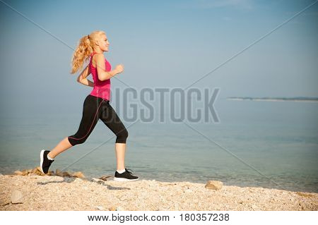 Jogging In Th Beach - Woman Runns Near Sea On Early Summer Morning