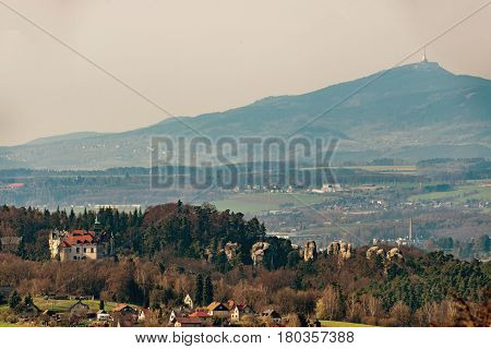 Chateau Hruba Skala in the Bohemia Paradise and the mount Jested in background.