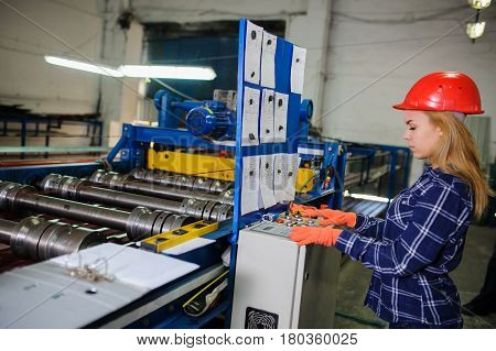 Woman In Red Safety Helmet Work As Industrial Worker