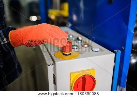 Operator Hand At Metal Roof Forming Machine
