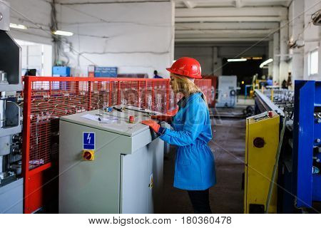 Woman In Red Safety Helmet Work As Industrial Worker