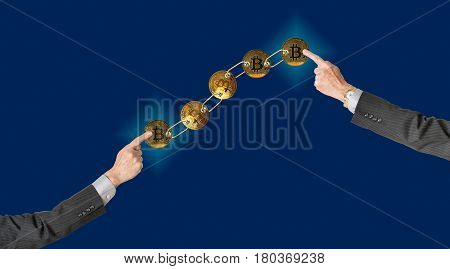 Set of gold bitcoins linked by chain on blue background with two arms pointing to ends to illustrate concept of blockchain for supply chain management