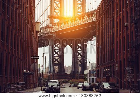 Sunset in New York City. Dumbo area with Manhattan Bridge scenic view.