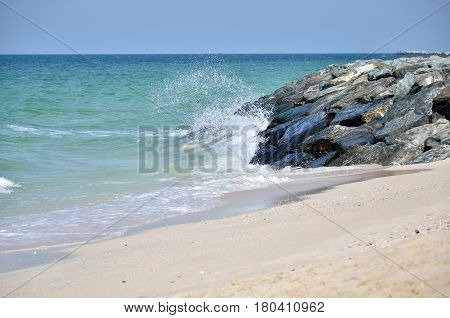 Water splashes on the seaside in the afternoon in sunny weather