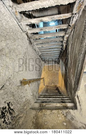 Old salt mine staircase covered with salt