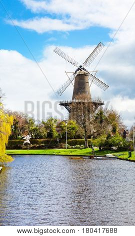 Windmill and canal view in Leiden, Holland in spring