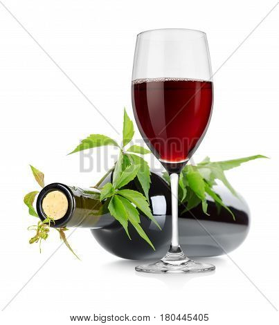 Wineglass and wine bottle with vine isolated on white background