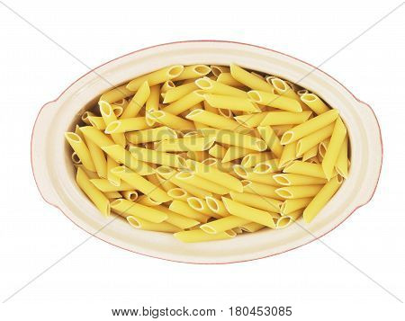 Organic raw penne pasta in the blow on white background
