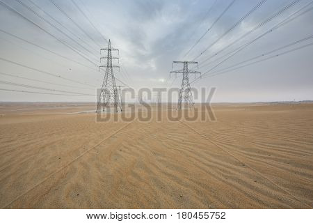 powerlines in a desert near Abu Dhabi