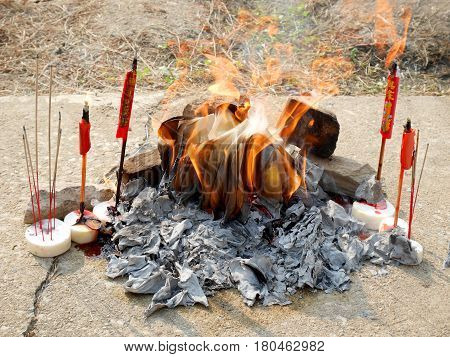 Ancestor offering burning at cemetery on Tomb Sweeping Day