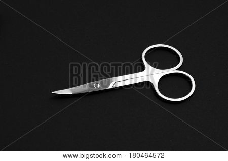 Scissors For Manicure Woman Nails On A Black Background. Tools
