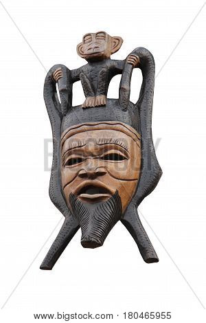 A Carved Tribal Wooden Face Mask and Monkey.