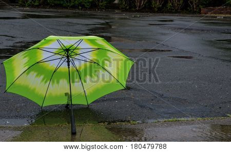 Umbrella in the street during a storm
