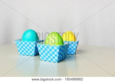 Painted  in different colors  Easter eggs on white background.
